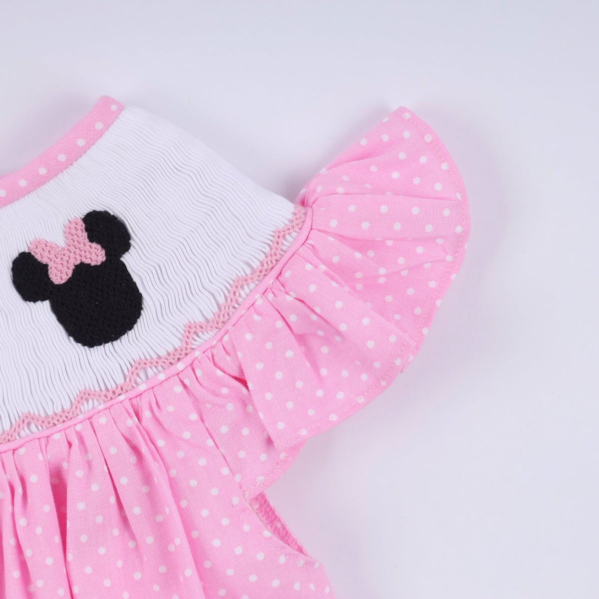 Pink character hand smocked dot ruffle dress