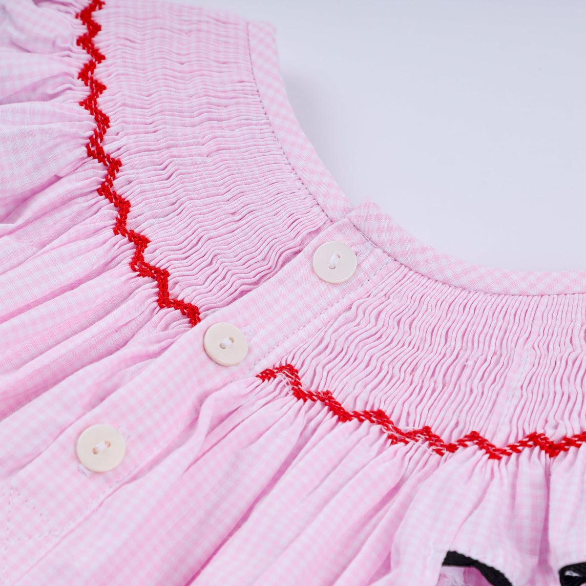 Red character hand smocked plaid ruffle bubble