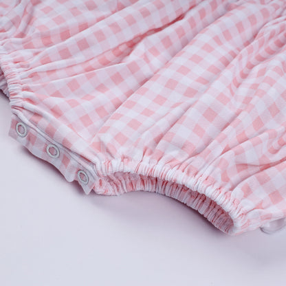 Pink character hand smocked gingham ruffle bubble