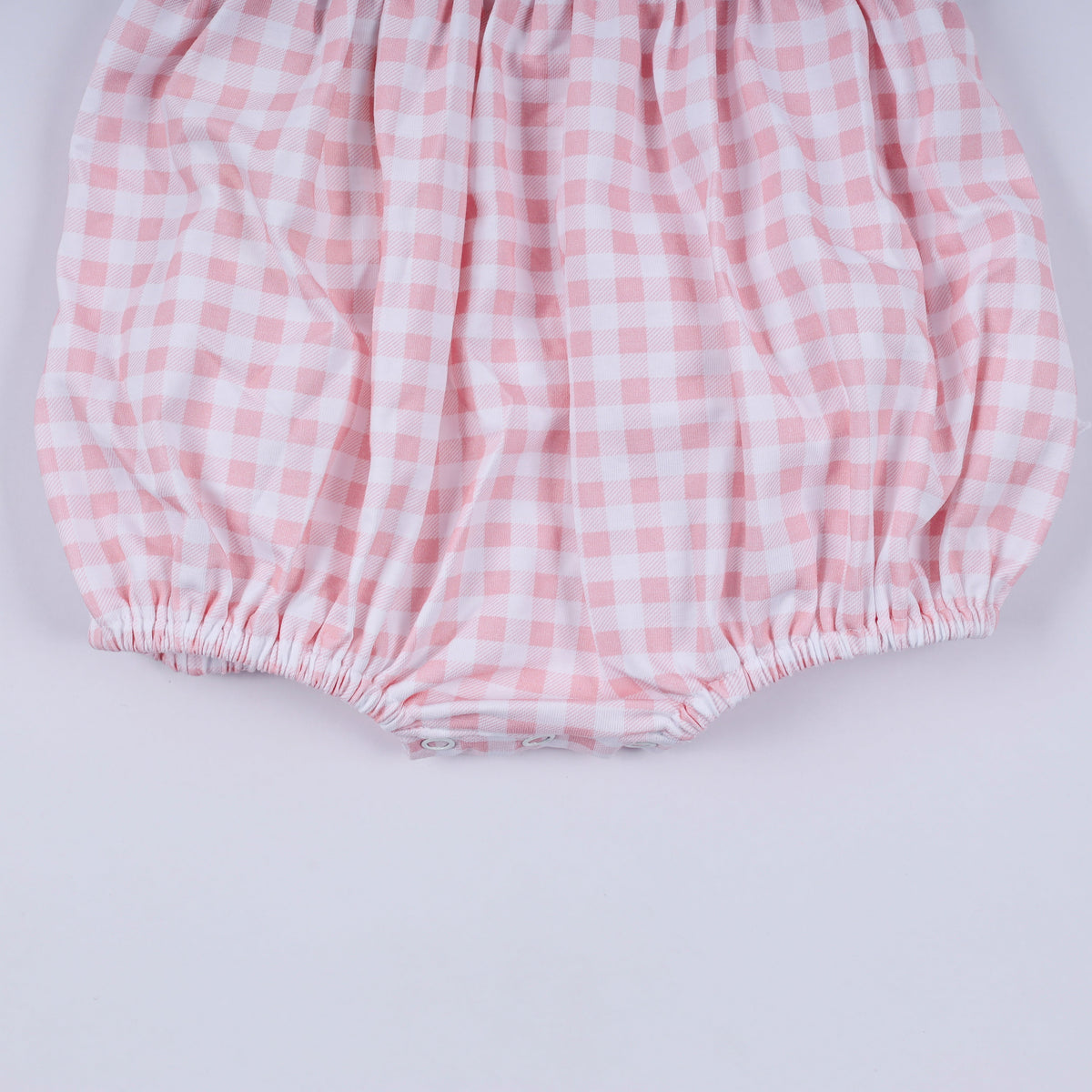 Pink character hand smocked gingham ruffle bubble